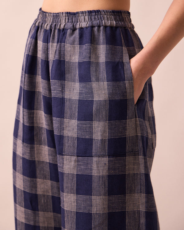 model wears huxley navy plaid linen trousers detail
