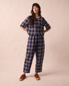 model wears huxley navy plaid linen trousers left