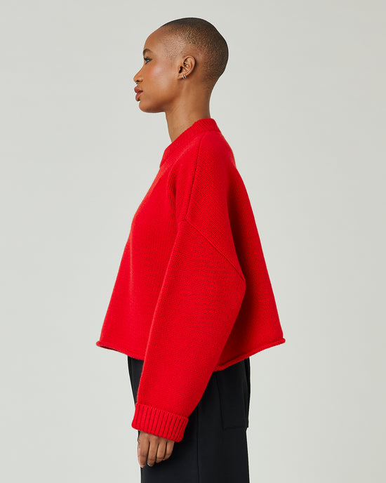 model wears flame red coco jumper 