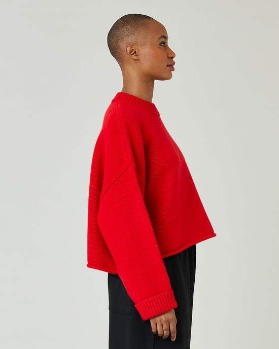 model wears flame red coco jumper 