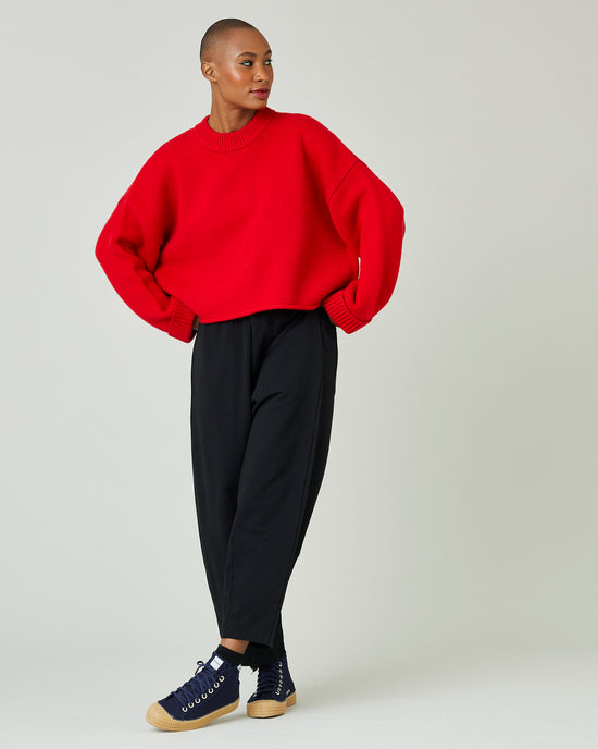 model wears flame red coco jumper 