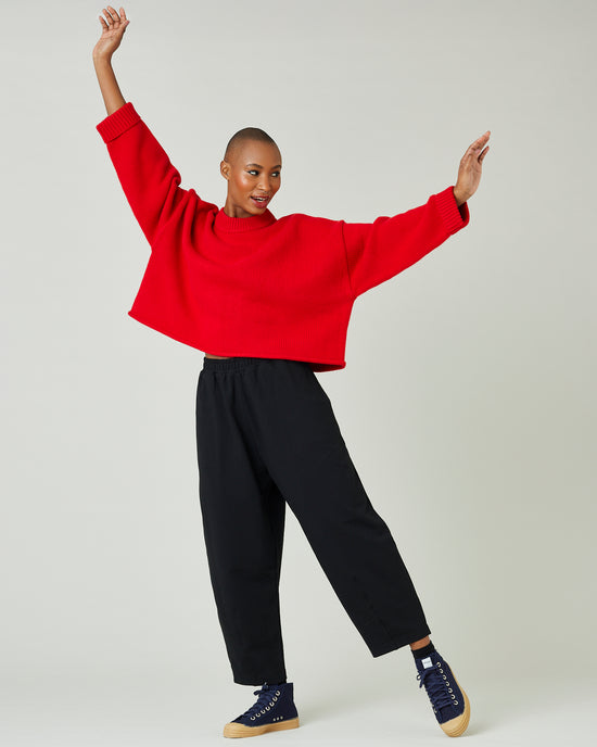 model wears flame red coco jumper 