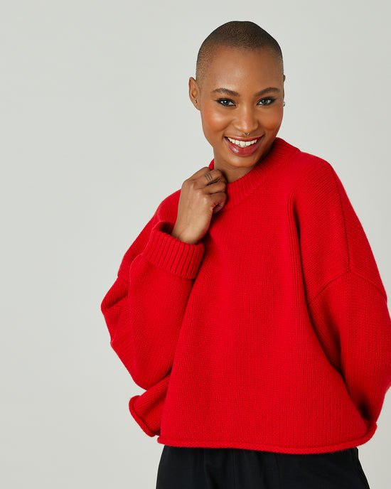 model wears flame red coco jumper 