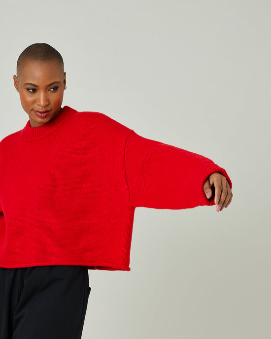 model wears flame red coco jumper 