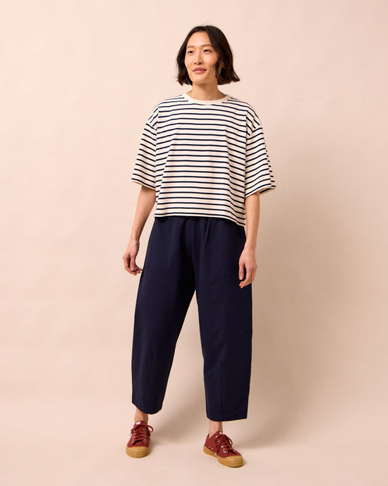 model wears huxley ink jersey trousers right