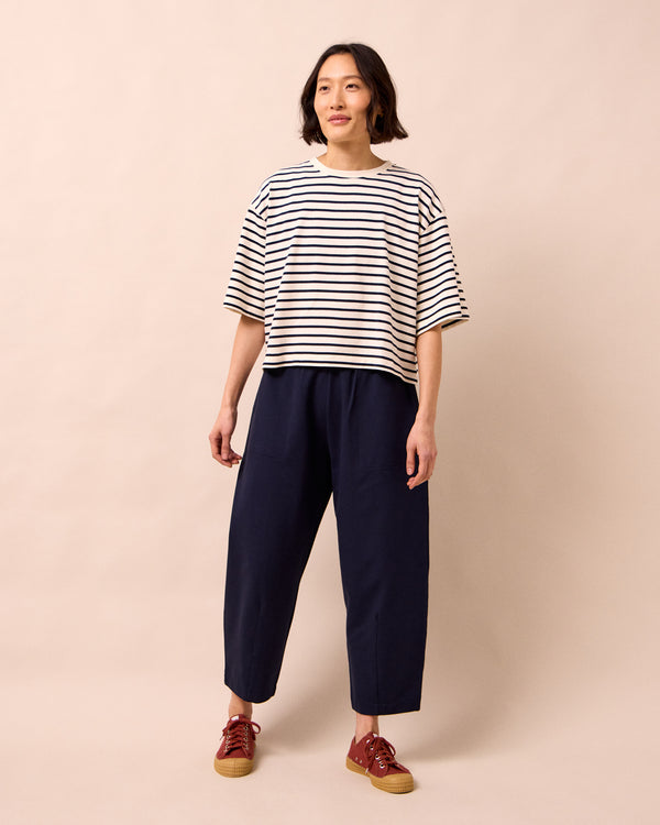 model wears huxley ink jersey trousers right