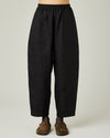 model wears black linen huxley trousers front