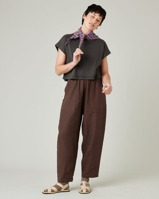 model wears brown huxley linen trousers