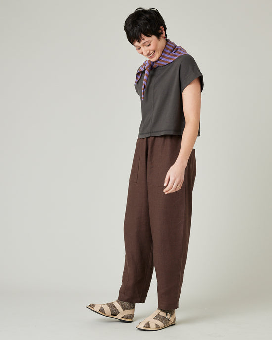 model wears brown huxley linen trousers