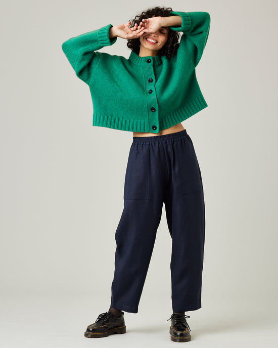 model wears navy huxley linen trousers 