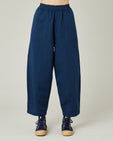 model wears navy twill huxley trousers front