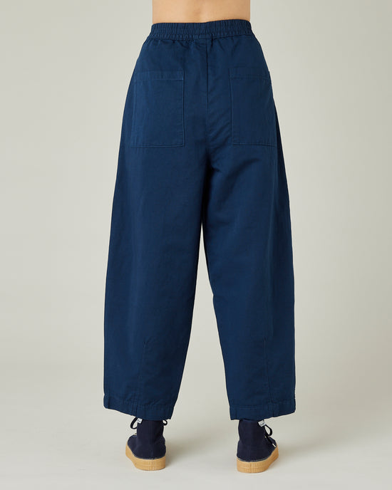 model wears navy twill huxley trousers back