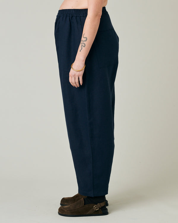 pregnant model wears navy huxley linen trousers 