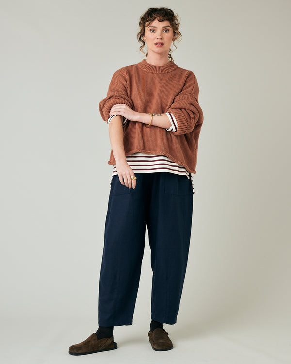 pregnant model wears navy huxley linen trousers 