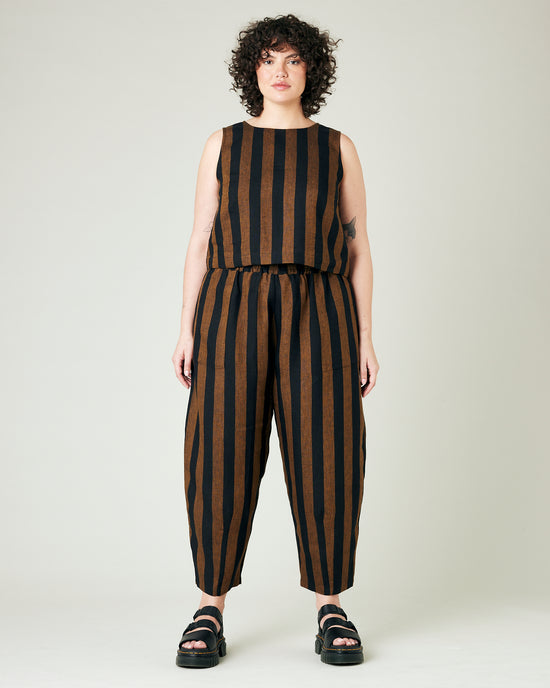 model wears rust stripe huxley trousers