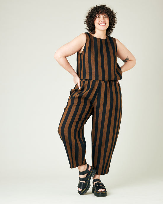 model wears rust stripe huxley trousers