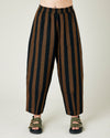 model wears rust stripe huxley trousers front