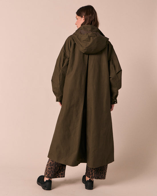 model wears indy dark olive coated cotton jacket
