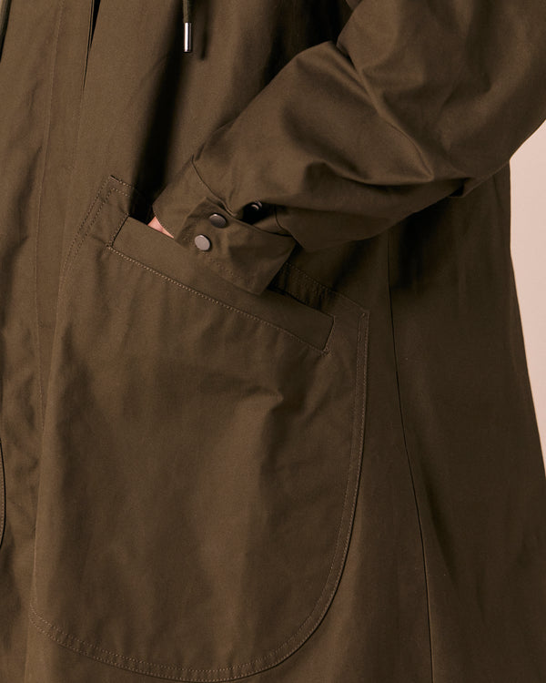 model wears indy dark olive coated cotton jacket