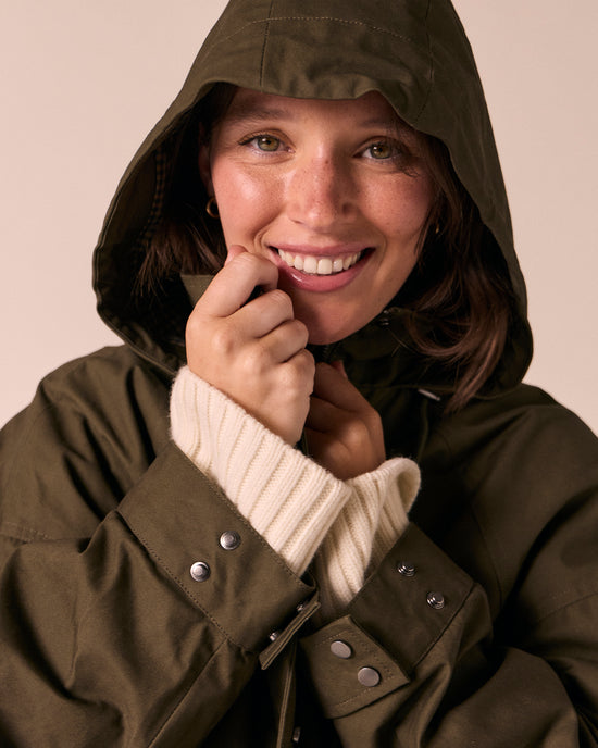 model wears indy dark olive coated cotton jacket