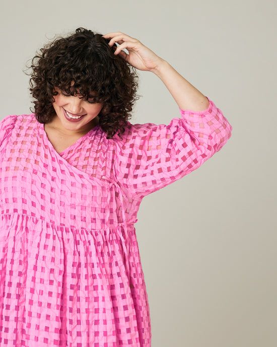 model wears pink organza izzy dress