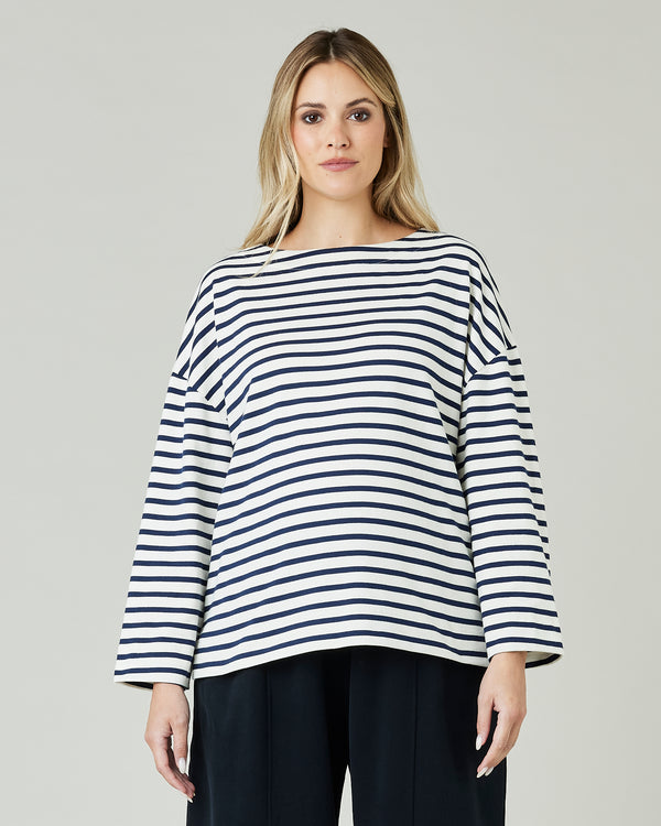 pregnant model wears ecru and navy striped breton top