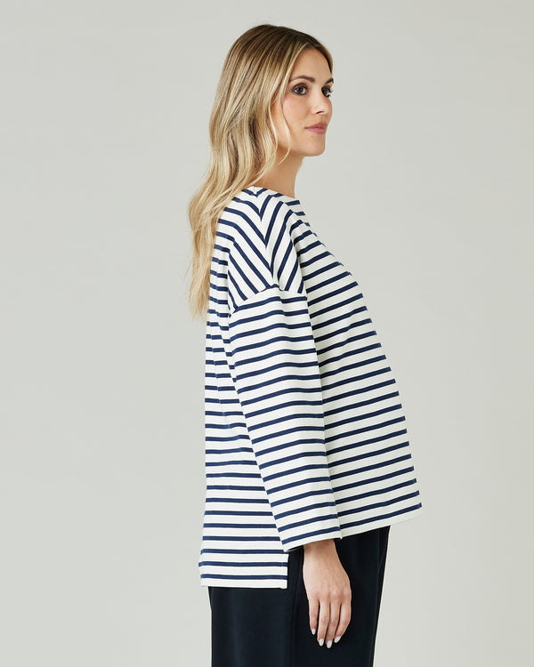 pregnant model wears ecru and navy striped breton top