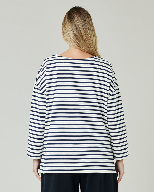 pregnant model wears ecru and navy striped breton top