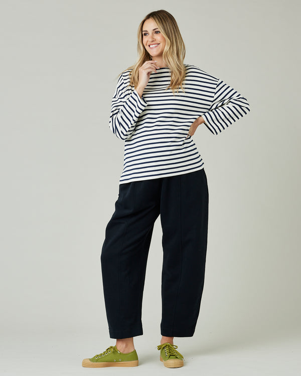 pregnant model wears ecru and navy striped breton top