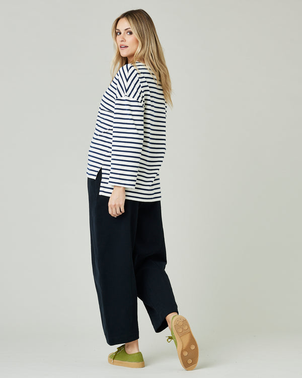 pregnant model wears ecru and navy striped breton top
