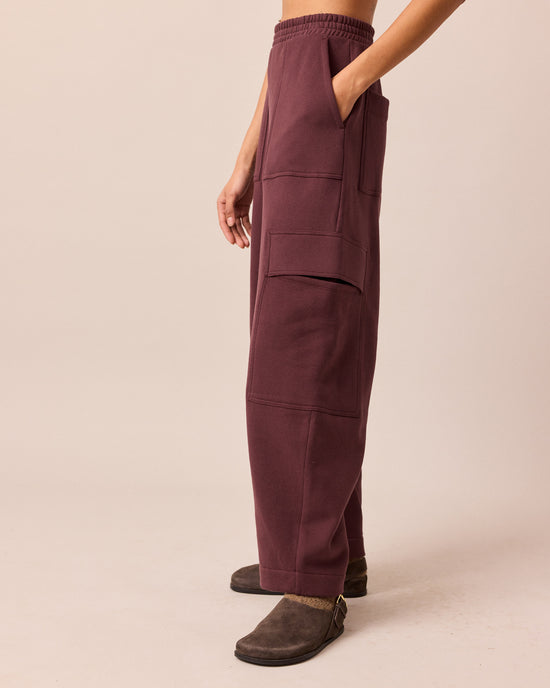 model wears jessie burgundy jersey trouesrs left