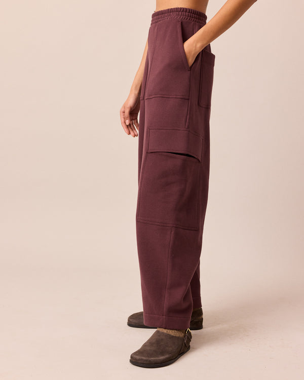 model wears jessie burgundy jersey trouesrs left