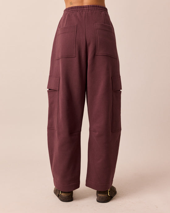 model wears jessie burgundy jersey trouesrs back