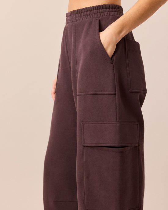 model wears jessie prune jersey trousers left