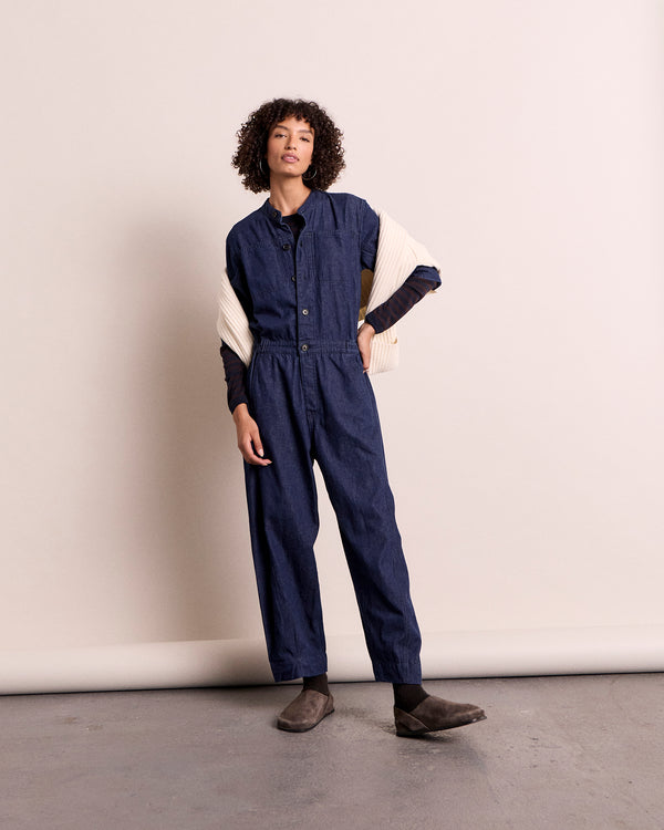 model wears jill dark wash denim jumpsuit