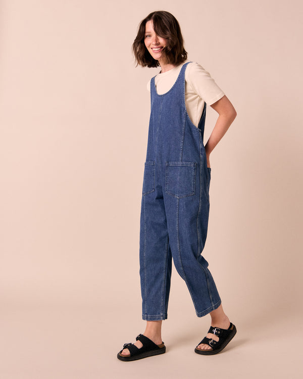 model wears jolie mid blue denim jumpsuit