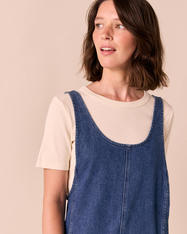 model wears jolie mid blue denim jumpsuit
