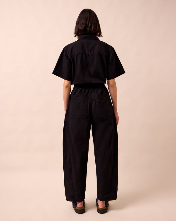 model wears joy black textured cotton jumpsuit