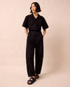 model wears joy black textured cotton jumpsuit