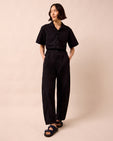 model wears joy black textured cotton jumpsuit