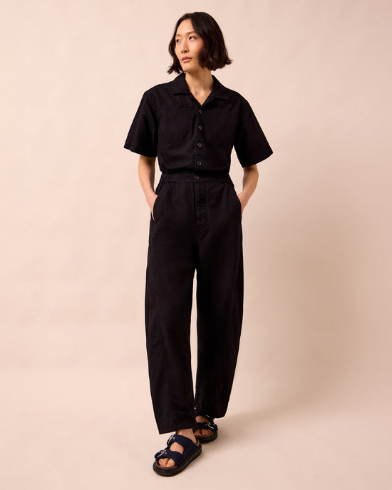 model wears joy black textured cotton jumpsuit