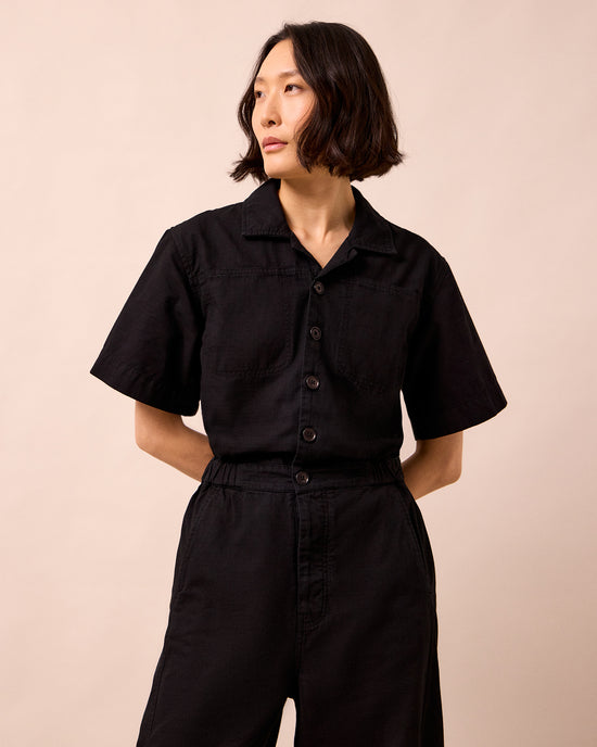 model wears joy black textured cotton jumpsuit