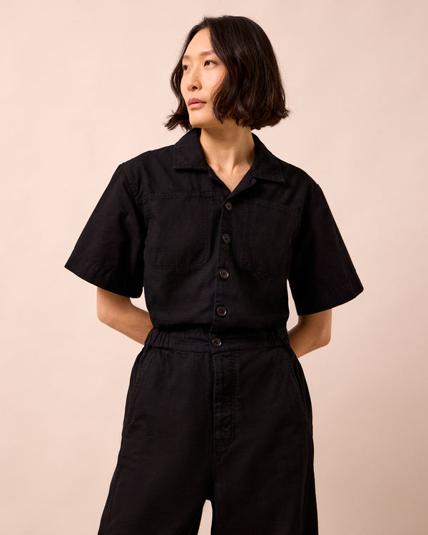 model wears joy black textured cotton jumpsuit