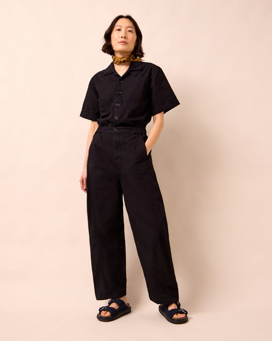 model wears joy black textured cotton jumpsuit