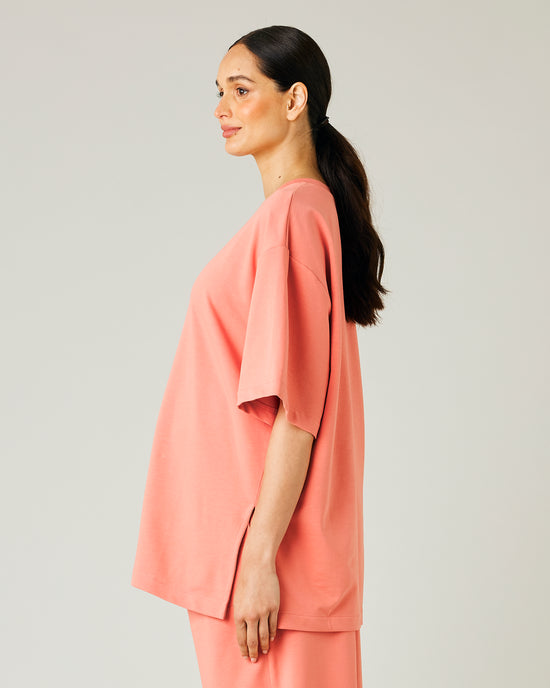 pregnant model wears coral jersey jude top