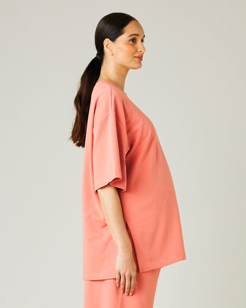 pregnant model wears coral jersey jude top