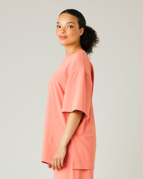 model wears coral jersey jude top