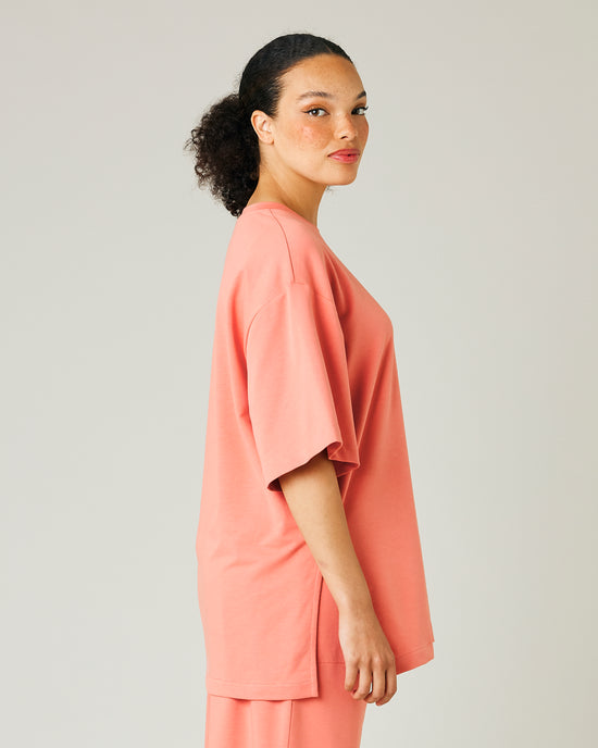 model wears coral jersey jude top