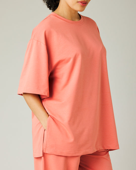 model wears coral jersey jude top