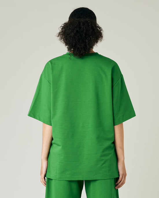 model wears juniper green jersey jude top